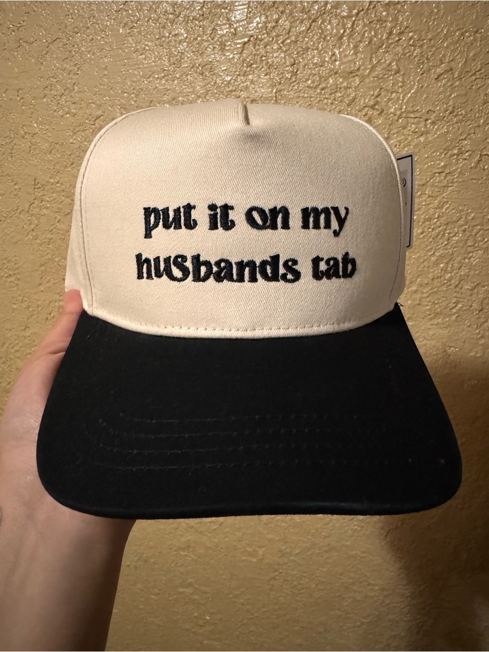 Put it on my husbands tab hat with pony tail opening